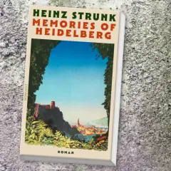 Heinz Strunk neues Buch: "Memories of Heidelberg" Roman, ein Blick auf die malerische Stadt mit Schloss und Neckar.