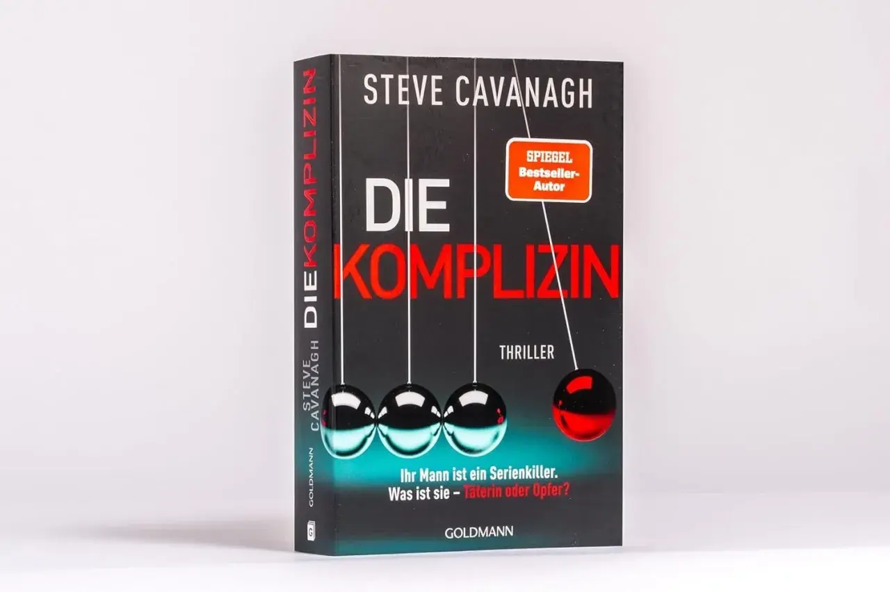 Steve Cavanaghs Thriller-Bestseller "Die Komplizin" mit einem Newtonschen Pendel. Ist ihr Mann ein Serienkiller? Täterin oder Opfer?