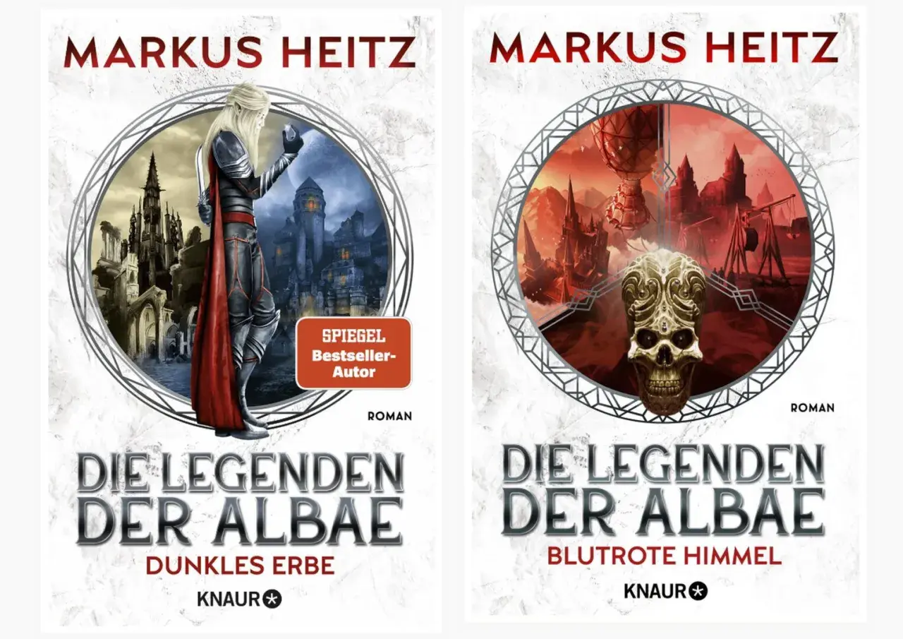 Zwei Buchcover von Markus Heitz: "Die Legenden der Albae - Dunkles Erbe" mit einem Elfen vor einer düsteren Stadt und "Die Legenden der Albae - Blutrote Himmel" mit einem Totenkopf vor einer apokalyptischen Landschaft.