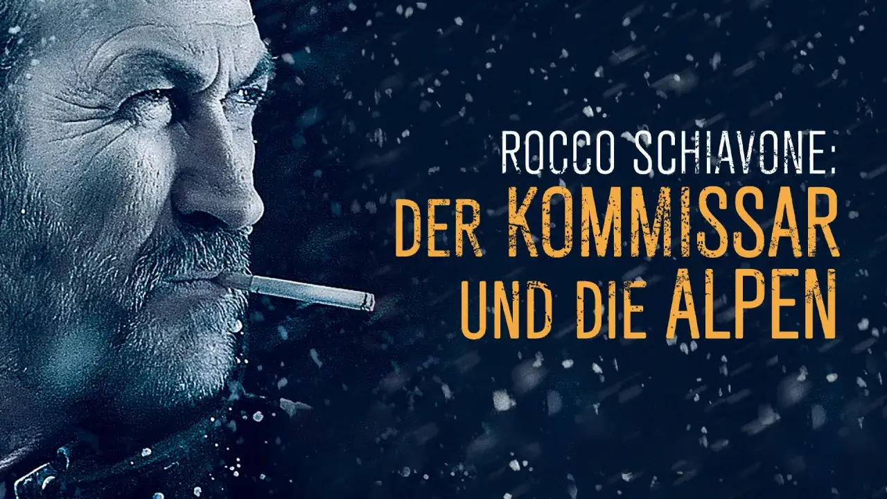 Rocco Schiavone, der Kommissar und die Alpen, raucht im Schneegestöber.